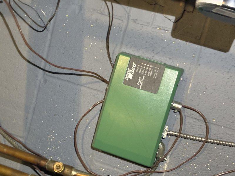 Performed standard boiler tune-up service including inspection and cleaning of mesh filter component. Examined Taco control module and associated wiring connections to ensure proper functionality. System returned to normal operating condition after service.