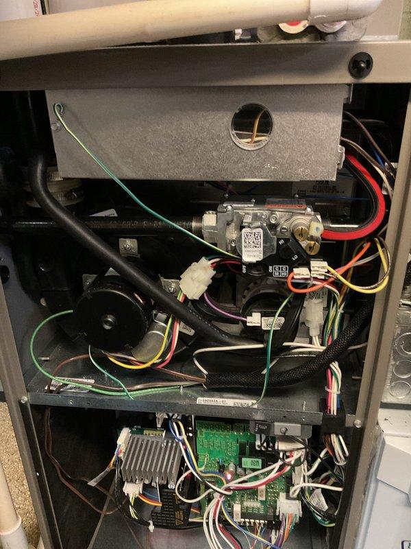 Responded to no-heat call for disabled customer reporting furnace failure and difficulty reinstalling AprilAire filter. Diagnostic inspection revealed fault in electronic control board and wiring connections at gas valve assembly. Repaired electrical connections, reset control system, and properly installed air filter, restoring normal heating function.