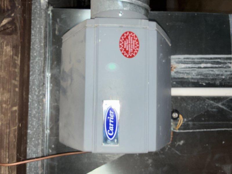 Performed tune-up service on 7-year-old Carrier furnace. Inspected system components including air handler, ductwork connections, and refrigerant lines, finding all in normal working condition. Examined plumbing components including NIBCO valve and associated piping, noting some aging and corrosion on metal components but confirming proper functionality.