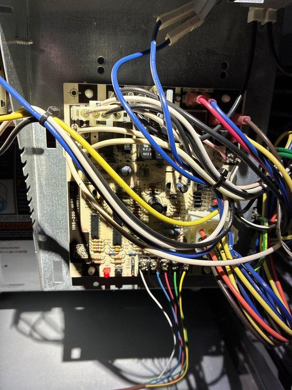 Performed comprehensive heating system maintenance on a forced-air furnace. Inspected interior components including motor assembly, electrical connections, and control board circuitry. All wiring connections were verified secure with no signs of wear or damage, and system was confirmed to be functioning within normal operating parameters.