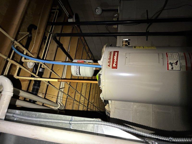 Completed furnace tune-up service as scheduled. During inspection, noted the presence of an A.O. Smith ProMax water heater installation with PEX water lines and appropriate venting. Verified water heater specifications from manufacturer label to ensure proper operation parameters.