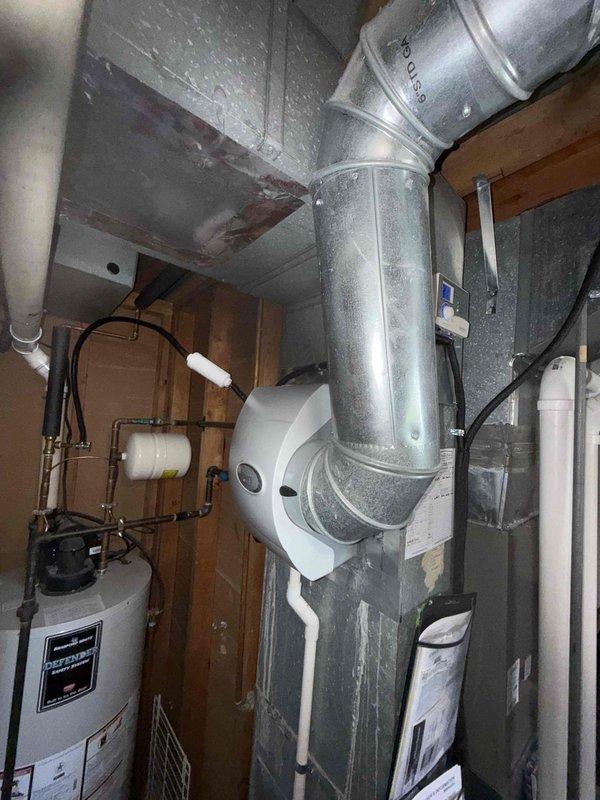 Responded to service call for IAQ system leaking water. Upon inspection, identified condensation forming on metal ductwork connected to the Aprilaire humidifier unit. Issue persists despite previous service attempts.