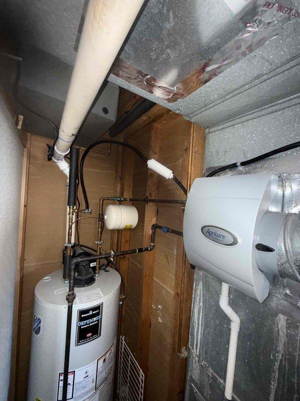 Responded to service call for IAQ system leaking water. Upon inspection, identified condensation forming on metal ductwork connected to the Aprilaire humidifier unit. Issue persists despite previous service attempts.