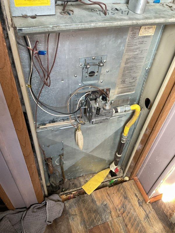 Diagnosed furnace ignition failure in a mobile home heating system (unit #50). Inspection revealed a failed capacitor preventing proper blower motor operation, which inhibited flame ignition sequence. Replaced defective capacitor and verified complete ignition cycle, restoring normal heat function. System now operating within manufacturer specifications.