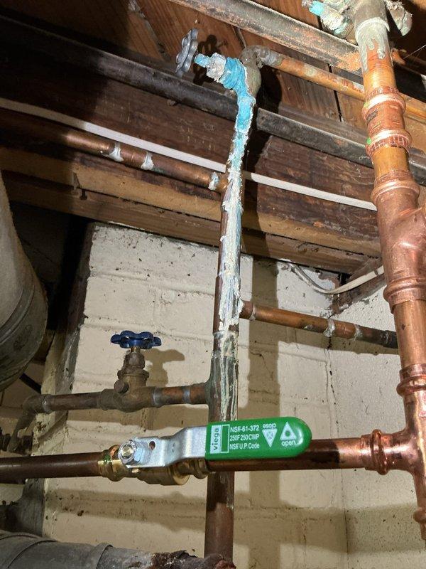Successfully replaced leaking 2017 Bradford White 40-gallon tall water heater with new equivalent unit featuring 6-year manufacturer warranty. Rebuilt cold and hot water lines, replaced corroded pipe fittings and shut-off valve on hot water lines, and installed new thermal expansion tank to complete the system upgrade.