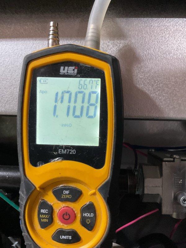 Performed comprehensive furnace maintenance service including gas pressure verification with UEi EM720 manometer (measured 0.008 inH₂O with ambient temperature of 66.7°F). Inspected gas line connections and verified integrity of pipe fittings, with particular attention to the union joint where blue pipe sealant was applied.