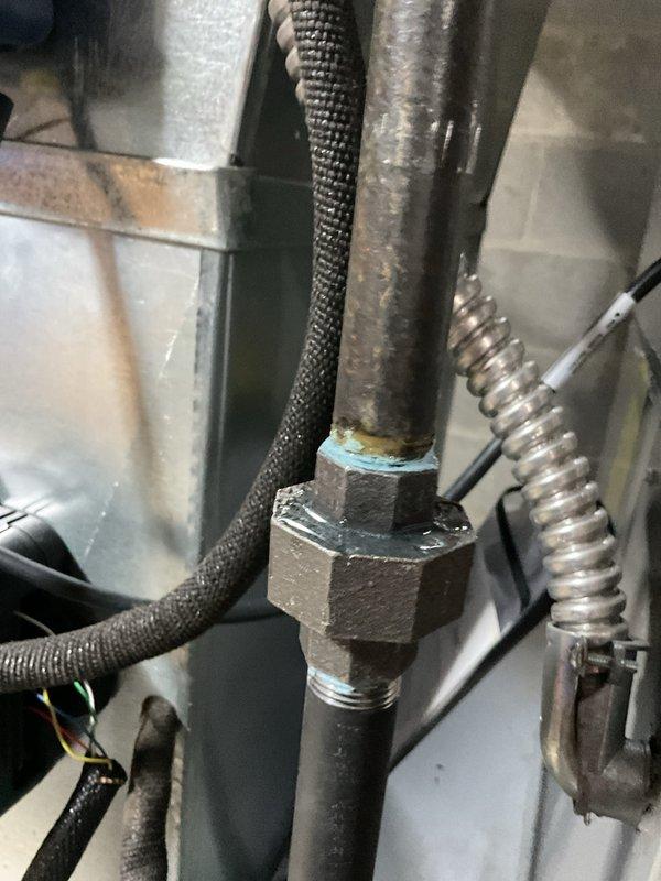 Performed comprehensive furnace maintenance service including gas pressure verification with UEi EM720 manometer (measured 0.008 inH₂O with ambient temperature of 66.7°F). Inspected gas line connections and verified integrity of pipe fittings, with particular attention to the union joint where blue pipe sealant was applied.