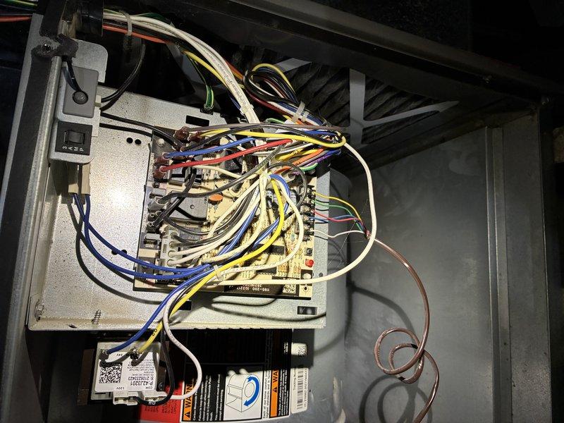 Performed scheduled MVP Heating maintenance service with comprehensive inspection of system components. Examined the electrical control panel and circuit board connections, verifying all wiring (yellow, red, blue, white, and green) was properly secured and in good condition. Inspected blower motor assembly and associated components within the furnace housing, confirming proper operation with no visible issues or required repairs.