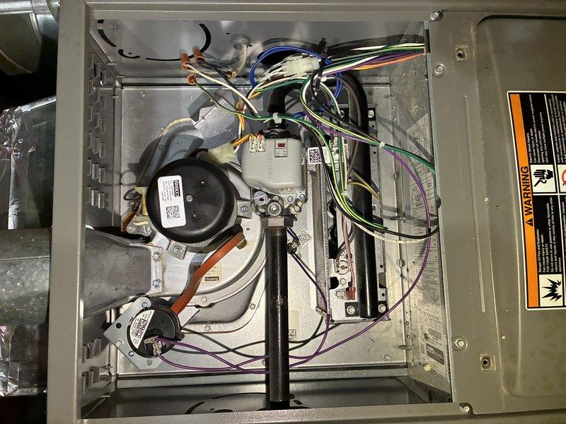 Performed scheduled MVP Heating maintenance service with comprehensive inspection of system components. Examined the electrical control panel and circuit board connections, verifying all wiring (yellow, red, blue, white, and green) was properly secured and in good condition. Inspected blower motor assembly and associated components within the furnace housing, confirming proper operation with no visible issues or required repairs.