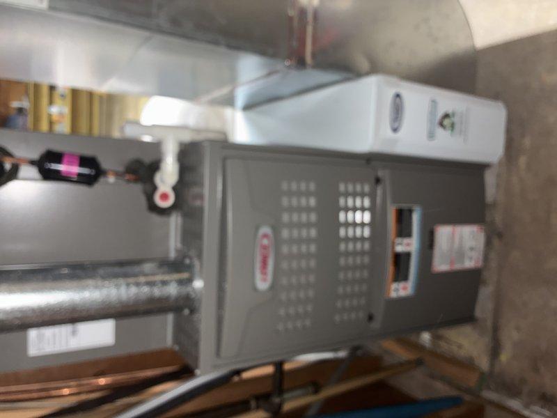 Completed routine maintenance on MVP furnace system. Inspected all components including heat exchanger, burners, blower assembly, and refrigerant lines. System appears to be properly installed on wooden supports with appropriate ductwork connections and is functioning within normal parameters.