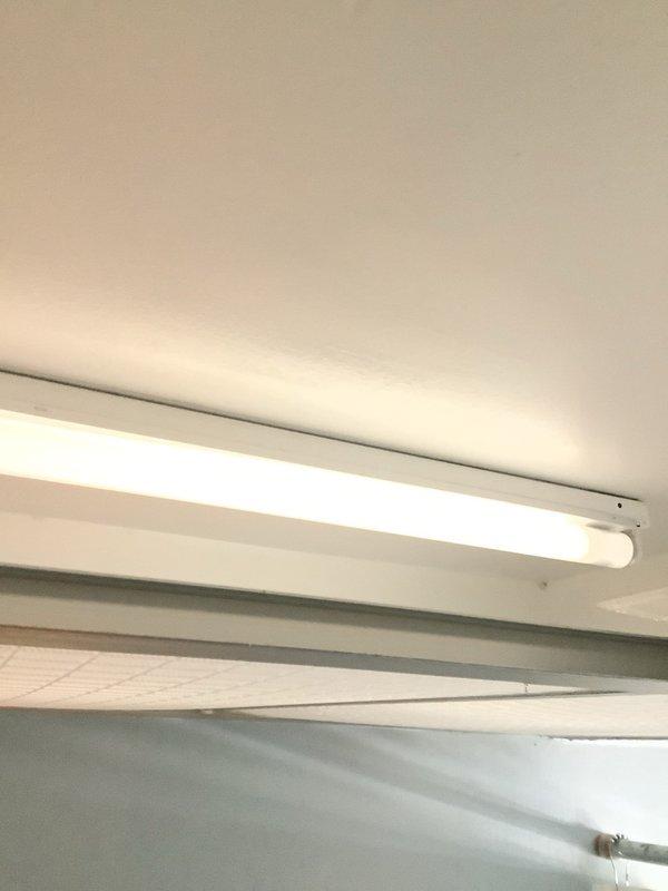 Responded to service call to inspect and replace bathroom electrical outlets. Examined ceiling-mounted fluorescent fixture in bathroom drop ceiling grid system. Inspected wiring for compatibility with customer's planned cooktop installation.