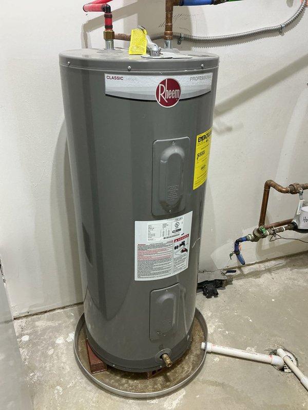 Successfully replaced 40-gallon electric water heater with new Rheem Classic Professional model. Installed expansion tank with proper copper piping connections and ensured all water supply/drainage connections were secure. System is functioning properly with all required safety components in place.