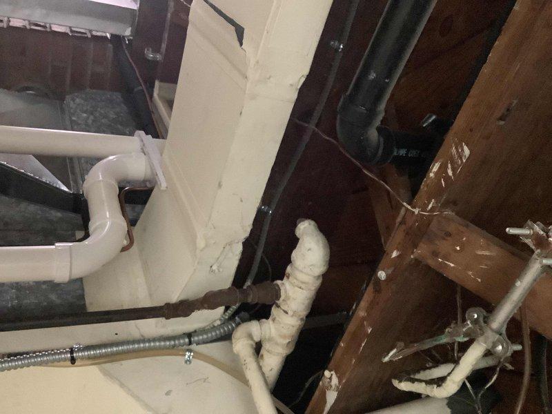 Conducted assessment of existing 10-year-old gas tank water heater in basement of 75-year-old home. Customer reported unit is failing and requested evaluation for potential replacement with tankless system. Inspected current plumbing infrastructure, including drainage pipes, supply lines, and ventilation, to determine feasibility of tankless installation.