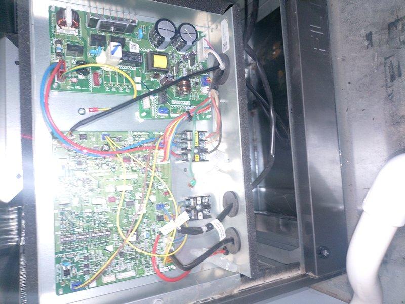 Performed routine maintenance on a 2-year-old Mitsubishi Electric heat pump system. Inspected outdoor condenser unit which was properly installed on stone base with good clearance. Examined internal control board and electrical connections - all components in normal working condition with no signs of wear or damage. System functioning within expected parameters after service.