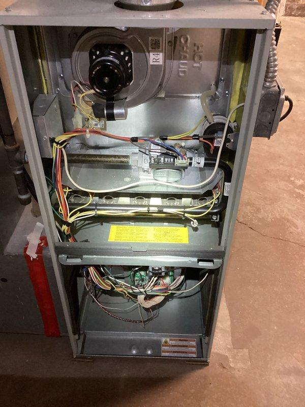 Performed scheduled furnace tune-up with comprehensive inspection of heating system. Removed and examined air filter, noting moderate dust accumulation requiring replacement. Inspected blower motor, electrical connections, and control board components to ensure proper operation and system efficiency.