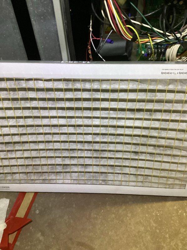 Performed scheduled furnace tune-up with comprehensive inspection of heating system. Removed and examined air filter, noting moderate dust accumulation requiring replacement. Inspected blower motor, electrical connections, and control board components to ensure proper operation and system efficiency.