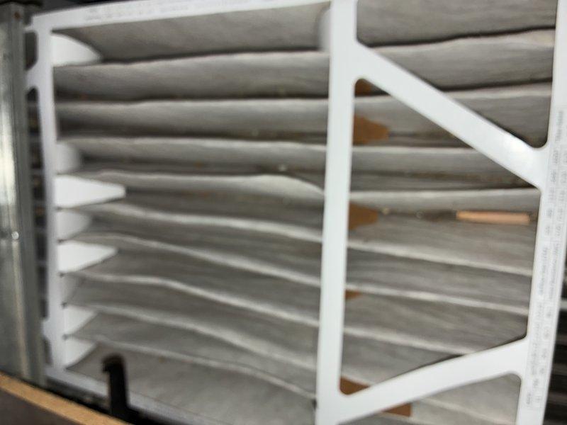 Performed scheduled furnace tune-up service, including inspection of gas valve assembly and verification of proper operation. Examined air filter which showed normal dust accumulation, requiring no immediate replacement. All system components functioning within normal parameters.