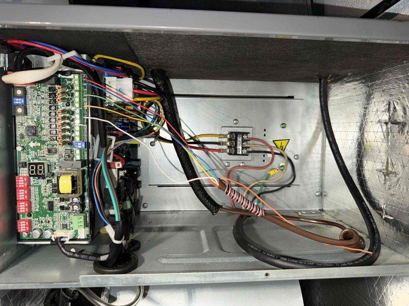 Performed annual maintenance on a 3-year-old furnace. Inspected control board functionality and electrical connections, noting all components in good working order with proper LED indicator response. Examined evaporator coil assembly which showed minimal buildup and good condition, with appropriate refrigerant line connections maintaining system integrity.