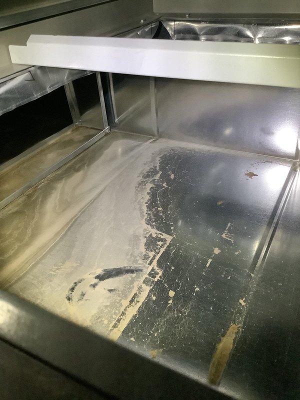 Inspected customer's newly installed furnace that was reported to be operating abnormally. Examination revealed significant contamination in the heat exchanger compartment requiring cleaning, and improper condensate drain line installation causing potential drainage issues. Thoroughly cleaned heat exchanger surfaces and properly reconfigured the PVC condensate drainage system with appropriate slope and sealant to ensure proper operation.