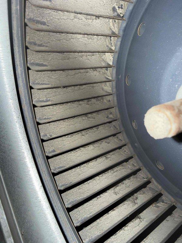 Responded to service call for 10-year-old furnace producing abnormal roaring noise while still providing heat. Inspection revealed significant dust accumulation on blower wheel assembly, which was causing imbalance and operational noise. Performed comprehensive cleaning of blower wheel and housing, restoring proper airflow and eliminating noise issue. System now operating within normal parameters.