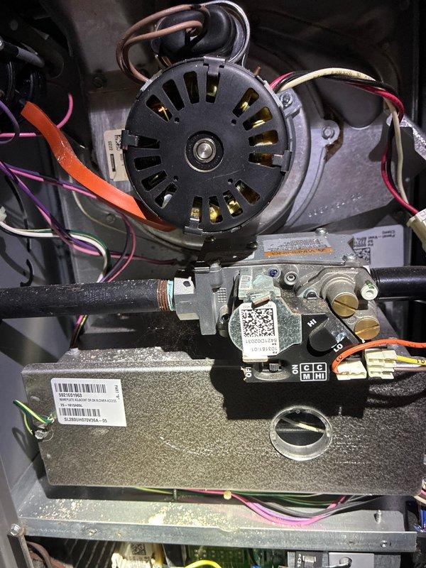 Performed scheduled furnace tune-up service on Lennox system. Inspected blower motor assembly, fan wheel, and electrical connections. Examined control board components and verified proper operation of gas valve assembly with all wiring connections secure and functional.