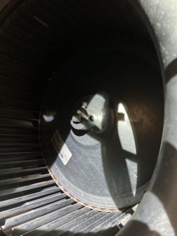 Responded to warranty service call for unit exhibiting loud banging noise during operation. Upon inspection, discovered significant dust accumulation on blower wheel assembly causing imbalance. Cleaned and rebalanced blower wheel, resolving the noise issue that was unrelated to previous capacitor and surge protector replacement.