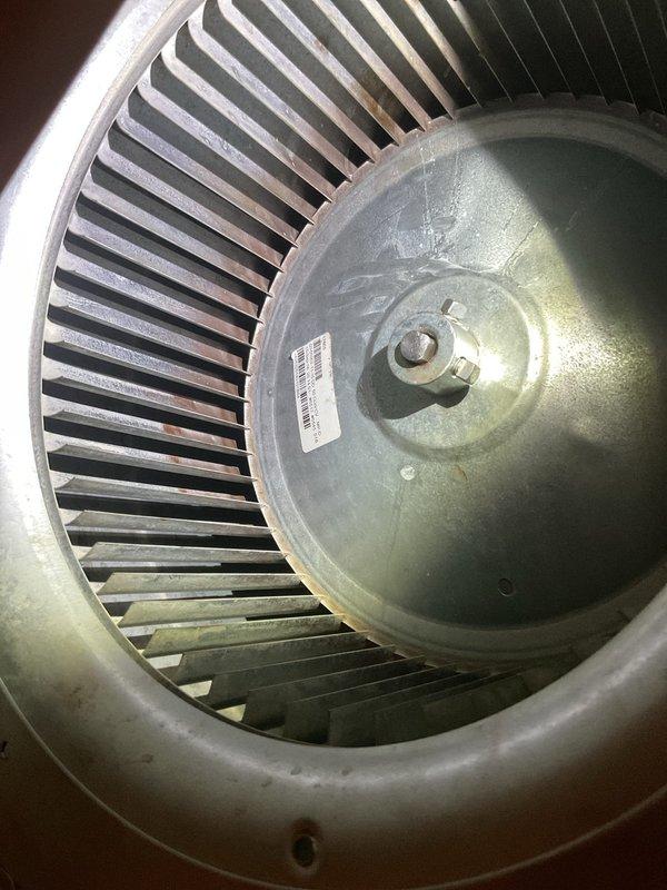 Responded to warranty service call for unit exhibiting loud banging noise during operation. Upon inspection, discovered significant dust accumulation on blower wheel assembly causing imbalance. Cleaned and rebalanced blower wheel, resolving the noise issue that was unrelated to previous capacitor and surge protector replacement.