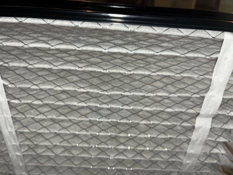 Performed scheduled MVP furnace maintenance including inspection of ductwork connections and sealing of joints. Removed and cleaned the existing pleated air filter, noting condensation present on filter surface, and reinstalled after service.