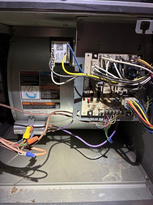 Performed diagnostic inspection of HVAC system humidifier per customer request. Examined control board connections and electrical components within the air handler. Identified and assessed condition of water panel in humidifier system. All connections appear properly secured with no visible damage to wiring or components.
