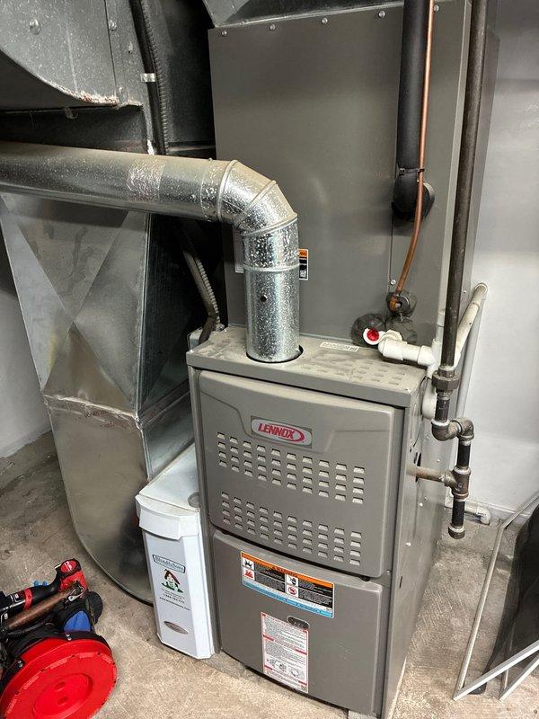 Performed standard furnace maintenance on 5-year-old Lennox system. Inspected heat exchanger and cooling coils, noting dust accumulation on fins affecting efficiency. Cleaned components and verified proper operation; customer will renew maintenance agreement.
