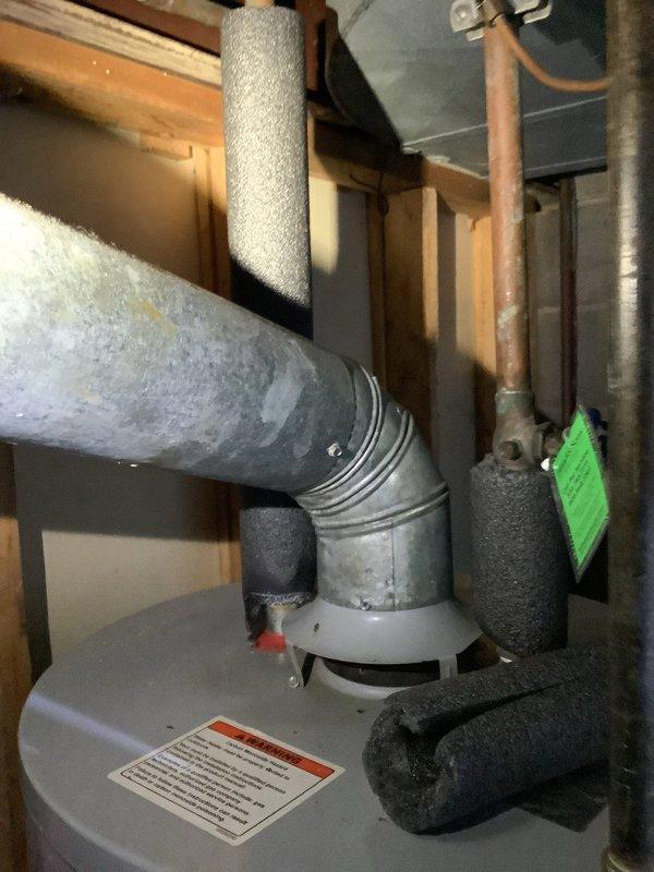 Replaced thermopile on AO Smith water heater and performed burner cleaning service to restore proper functionality. Observed significant mineral deposits and corrosion on copper piping near the unit. Installation of replacement parts completed successfully with all connections properly secured and system tested for normal operation.