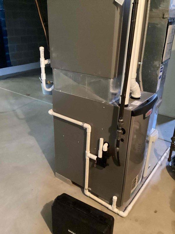 Performed comprehensive furnace maintenance tune-up for MVP customer on rescheduled appointment. Inspected gas furnace system including PVC condensate drainage lines, supply connections, and ventilation components. System appears to be properly installed with appropriate connections in basement utility area; no issues were identified during the service visit.