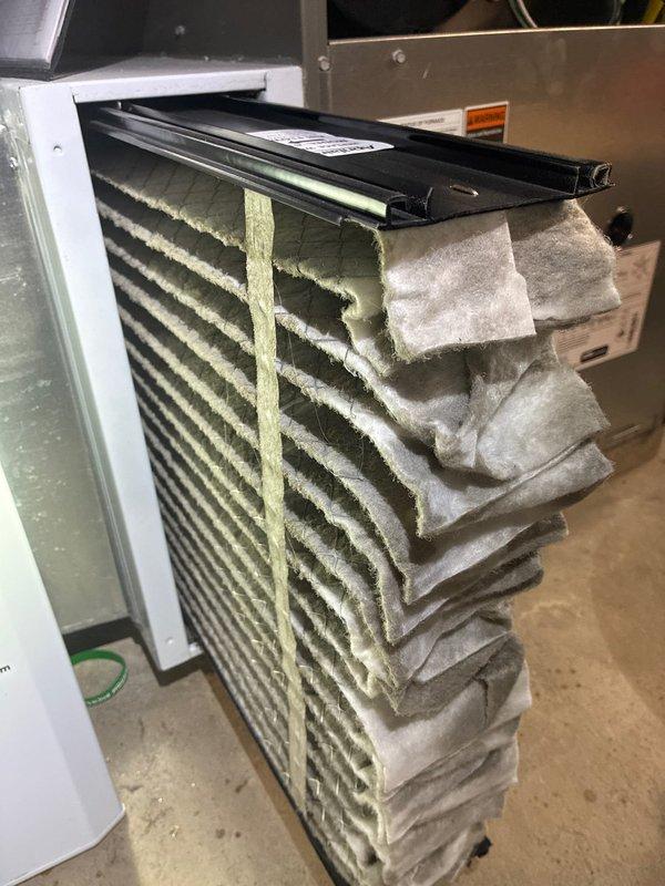 Performed routine maintenance on a 4-year-old gas furnace system. Inspected control board circuitry and electronic components for proper operation. Replaced severely clogged air filter which showed excessive dust accumulation affecting system efficiency.
