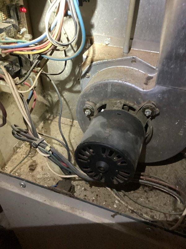 Diagnosed 15-year-old furnace with no heat issue; system was running but producing only cool air. Inspection revealed failed igniter with visible damage to the heating element. Removed and replaced igniter component, tested system operation, and confirmed proper heating function with normal flame sequence and appropriate temperature rise.