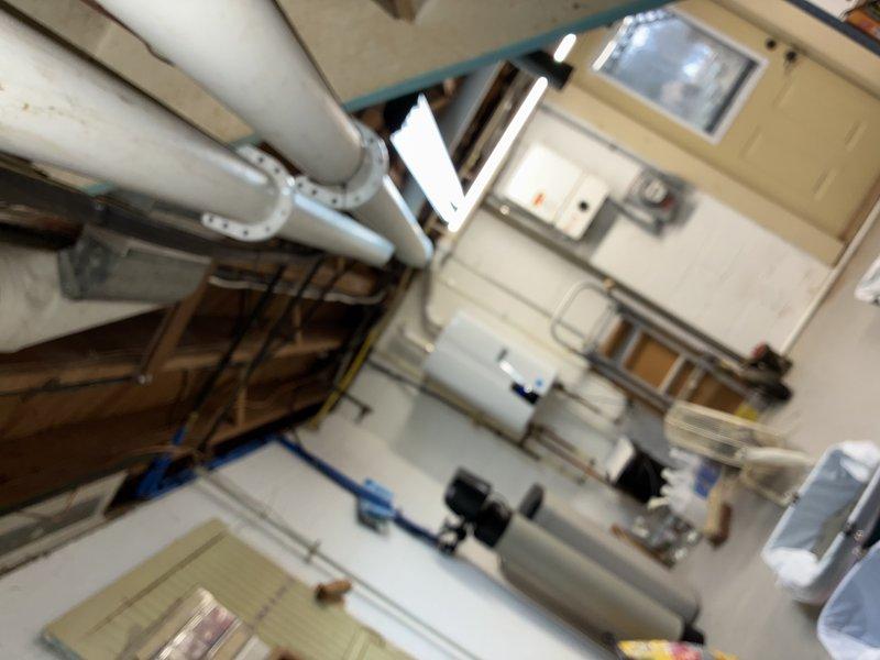 Performed scheduled maintenance visit on 3-year-old heating system. Inspected mechanical room components including water heater and PVC ventilation system. Confirmed proper operation of all heating elements and documented current system condition with photos for service records.