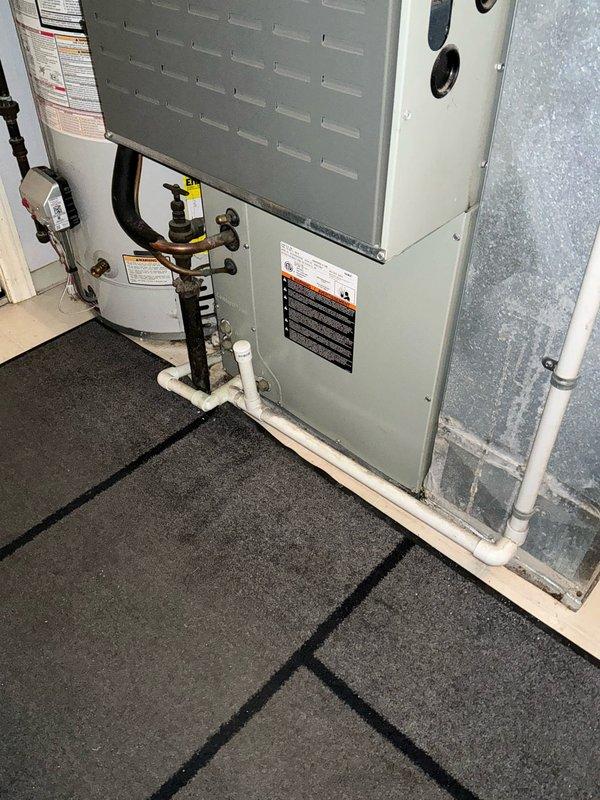 Completed inspection of 10-year-old Trane HVAC system and provided replacement estimate for a new MVP system. Unit is currently installed in utility room alongside water heater with appropriate connections to existing ductwork and piping. Photos documented current installation configuration for proper replacement planning.