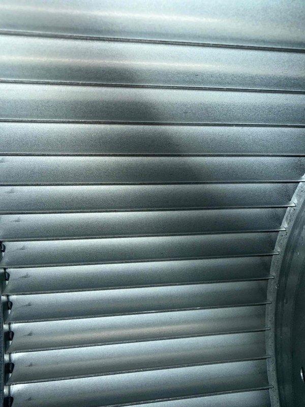 Performed scheduled maintenance service on furnace, focusing on cleaning the blower motor as requested. Removed accumulated dust from ventilation components and inspected metal fins/slats for proper condition. Heat exchanger and air handler components were found to be in functional condition with only minor signs of normal use.