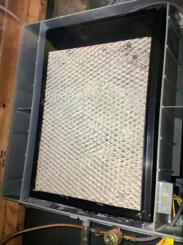 Performed scheduled maintenance on heating system. Inspected air handling unit and filter housing, noting partial dust accumulation on pleated filter. Filter was still functional with adequate airflow; system operating within normal parameters.