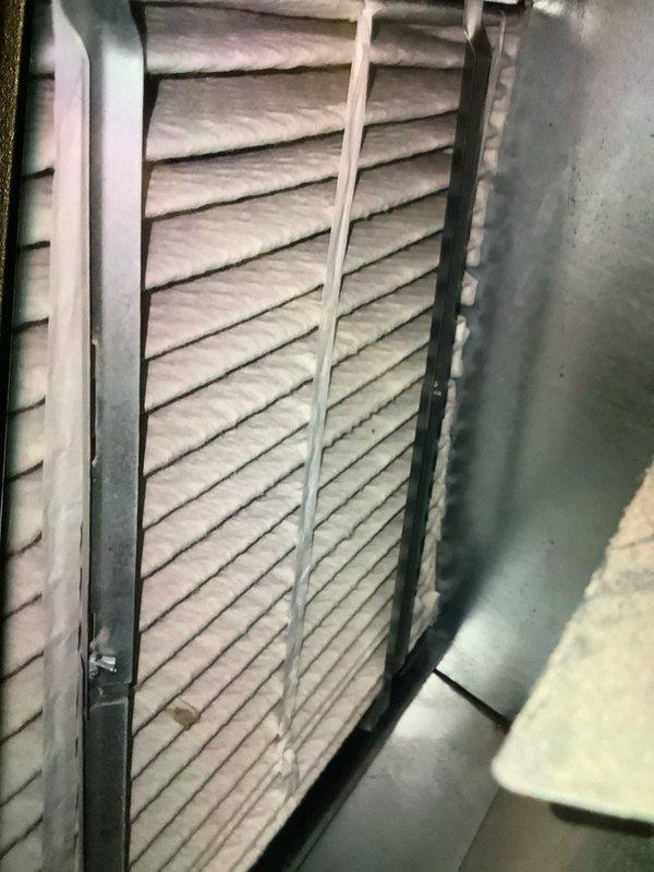Performed scheduled maintenance on heating system. Inspected air handling unit and filter housing, noting partial dust accumulation on pleated filter. Filter was still functional with adequate airflow; system operating within normal parameters.