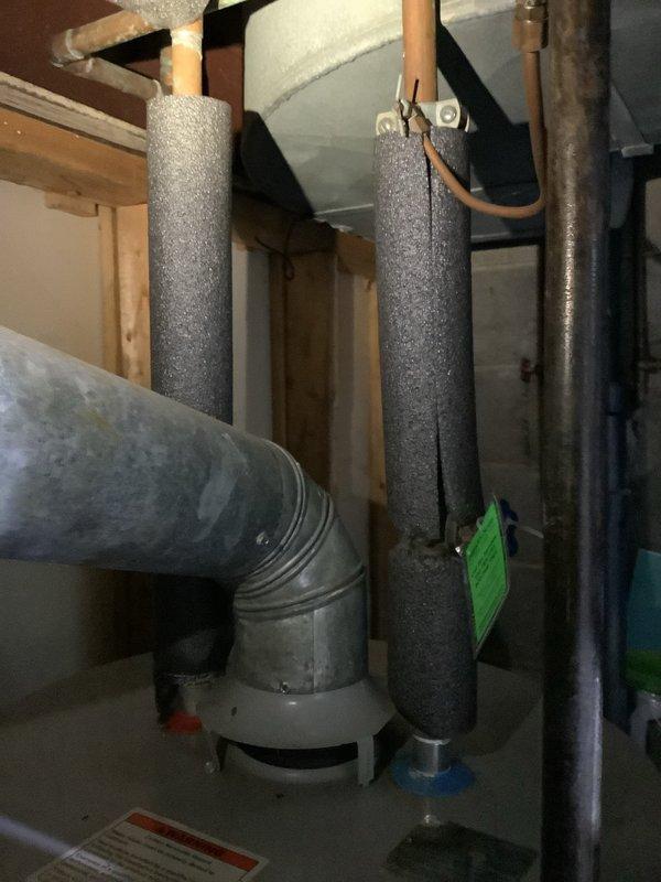 Completed the installation of a new 50-gallon A.O. Smith water heater with 6-year warranty, replacing the previous unit which showed signs of corrosion and water damage at the base. Installation included a new ball valve, thermal expansion tank, and replacement of an old saddle valve with a new 1/4" valve on the cold side for the ice maker connection. Noted cosmetic dent on bottom of tank as discussed during quote process.
