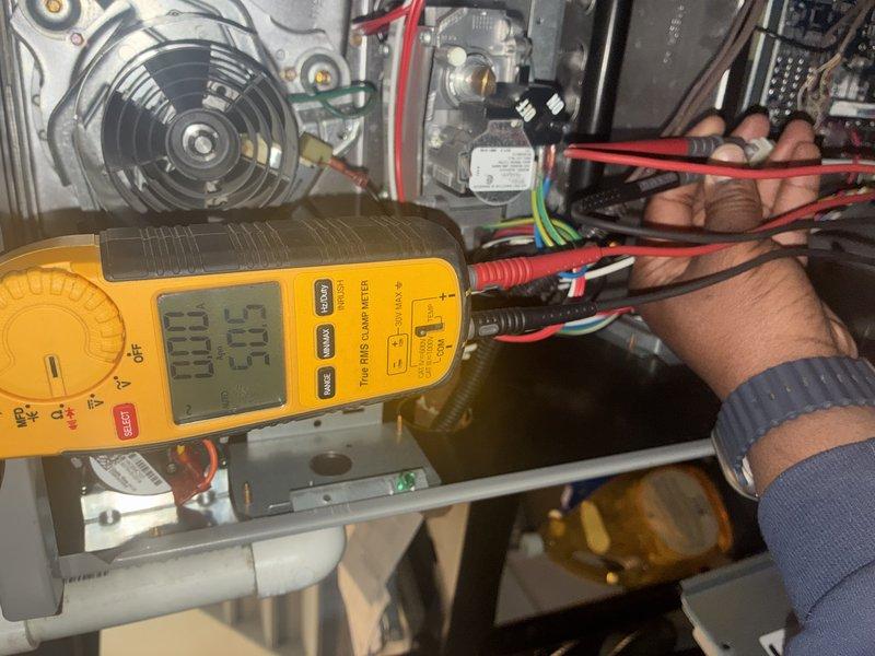Performed scheduled furnace tune-up service including comprehensive electrical testing with multimeter (reading 03.3) on control components and inspection of ventilation system. Checked airflow through return grille and verified proper operation of fan assembly. All components functioning within manufacturer specifications.