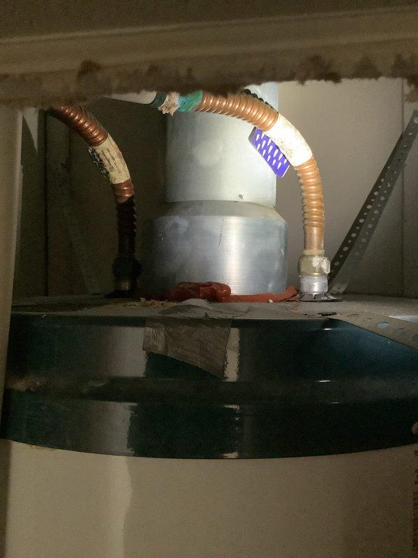 Performed site assessment for replacement of existing natural gas water heater. Inspected exterior venting system and verified appropriate termination point. Examined interior plumbing connections including copper supply lines and valve assembly. Provided customer with installation options and scheduled future installation appointment.