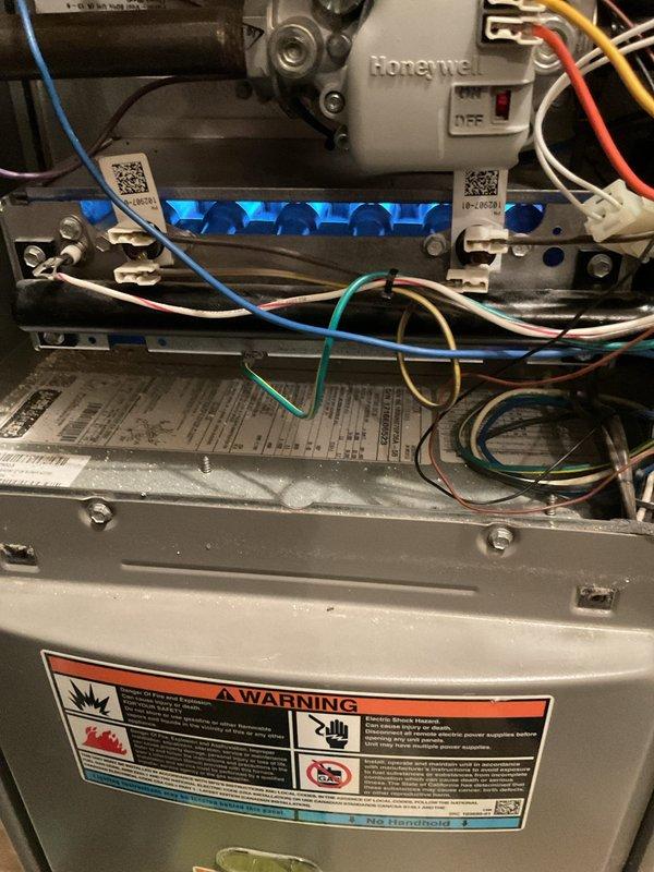 Diagnosed intermittent thermostat operation issue where system would not engage until temperature dropped to 67 degrees. Inspection revealed dust accumulation and corrosion on flame sensor, which was cleaned to restore proper ignition sequence and normal thermostat functionality.