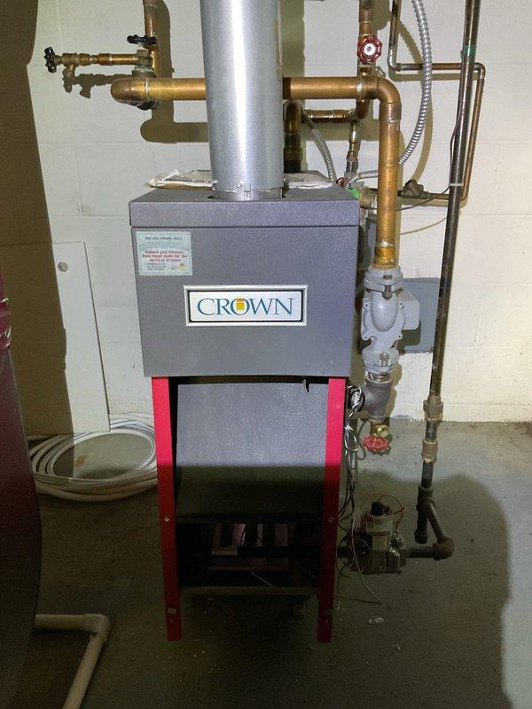 Performed routine maintenance on two HVAC units including a Crown boiler system. Inspected and replaced dirty air filters showing significant dust accumulation. Checked all copper piping connections, valve functionality, and exhaust venting for proper operation and safety compliance.