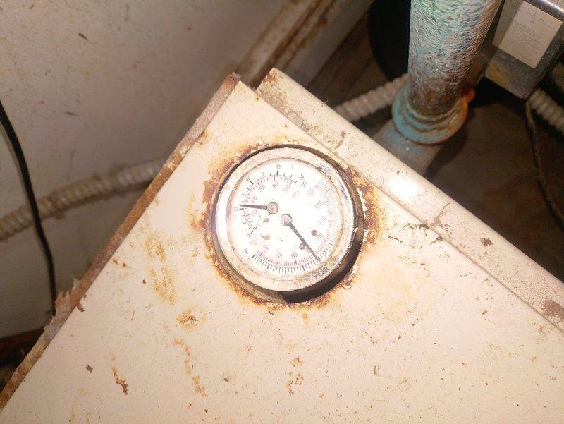 Diagnosed 16-year-old boiler with intermittent ignition failure. Inspection revealed significant corrosion on pressure gauge housing and deterioration of expansion tank plumbing components. System was operational at time of service, but aging equipment and visible oxidation indicate potential for future ignition failures.