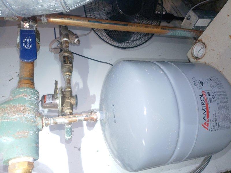 Diagnosed 16-year-old boiler with intermittent ignition failure. Inspection revealed significant corrosion on pressure gauge housing and deterioration of expansion tank plumbing components. System was operational at time of service, but aging equipment and visible oxidation indicate potential for future ignition failures.