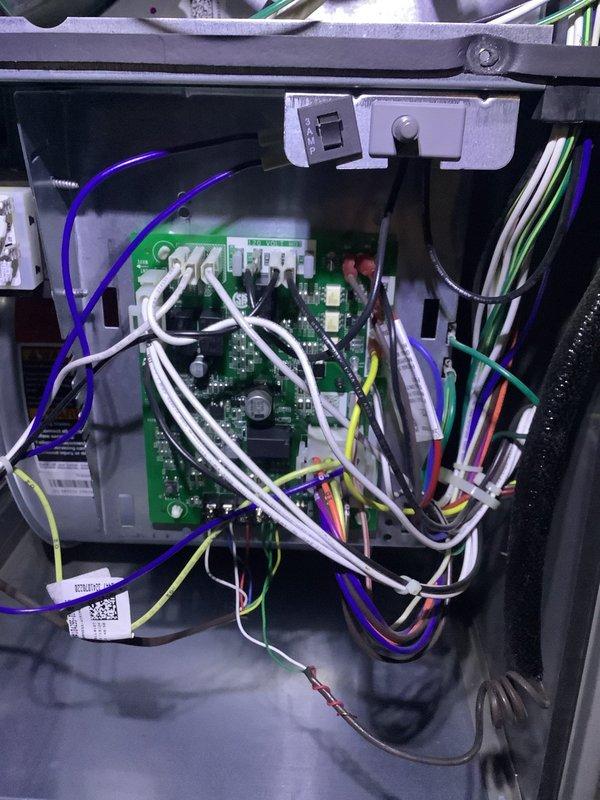Performed scheduled MVP heating maintenance service on Lennox furnace system. Inspected internal circuitry including PCB with multiple wire harnesses and connection terminals; all components found in normal working condition with no visible damage. Examined complete system installation including furnace unit, ductwork, plenum, and PVC exhaust venting with all systems functioning as designed.