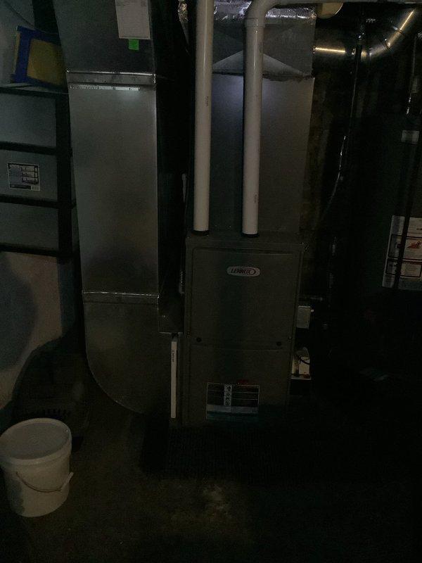 Performed scheduled MVP heating maintenance service on Lennox furnace system. Inspected internal circuitry including PCB with multiple wire harnesses and connection terminals; all components found in normal working condition with no visible damage. Examined complete system installation including furnace unit, ductwork, plenum, and PVC exhaust venting with all systems functioning as designed.
