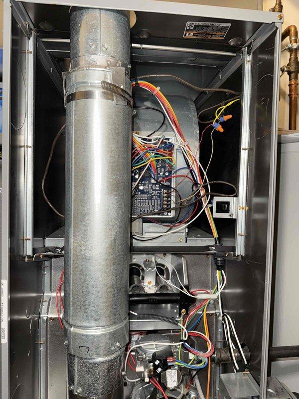 Performed scheduled MVP heating maintenance service on residential HVAC system. Conducted full inspection of furnace interior components including control board, wiring connections, and blower motor assembly. Observed normal condensation patterns on heat exchanger components with no signs of damage or operational concerns.