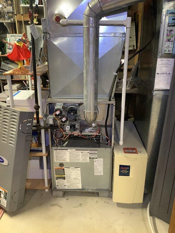 Performed annual furnace tune-up and diagnostic testing due to customer complaint of loud noise during fan operation. Conducted combustion analysis with Bacharach analyzer showing 81.0% efficiency, CO levels at 26ppm, and CO2 at 5.2% for natural gas system. Inspected internal components with access panel removed, adjusted fan assembly to eliminate noise issue, and verified proper system operation before completion.